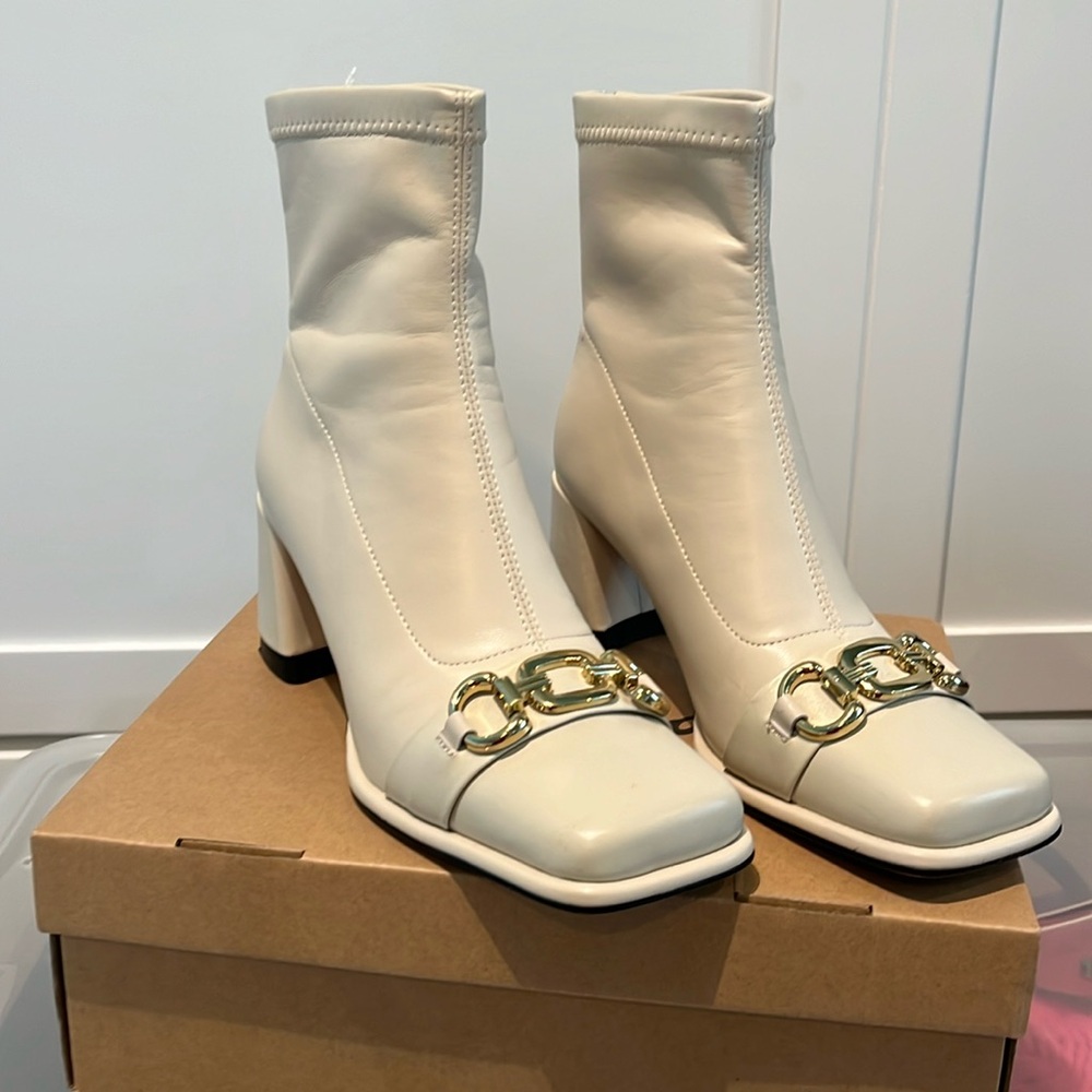 Larosa cream colored short boot with gold buckle accent